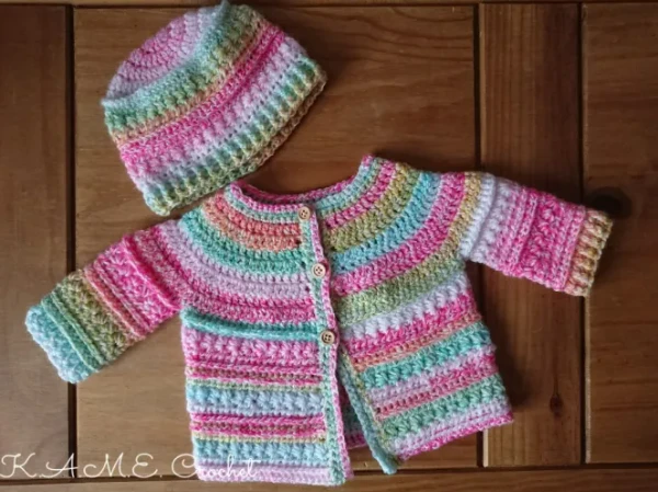 Striped newborn baby cardigan featuring crochet star stitch.
