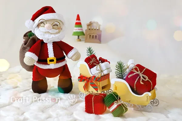 A crochet Santa doll complete with sack and gifts.