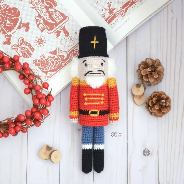 A crochet nutcracker doll.