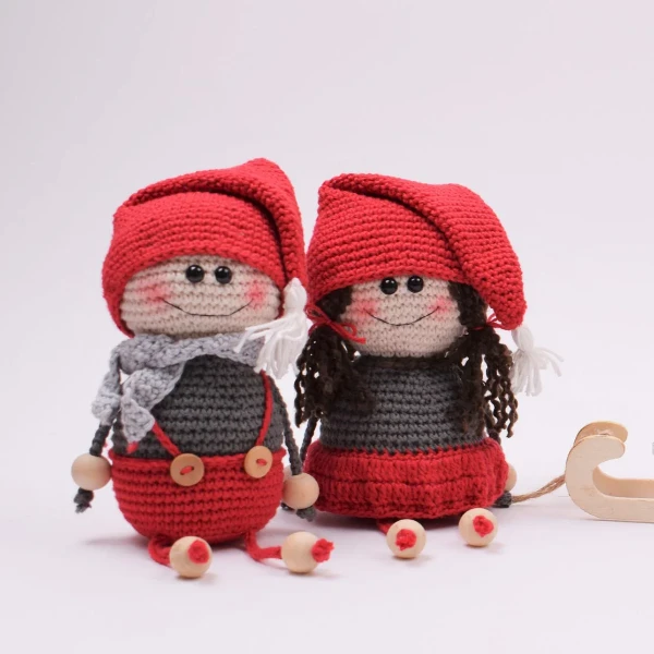 A pair of crochet elf dolls.