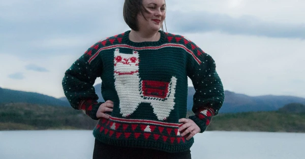 A colourwork Christmas sweater featuring an alpaca.