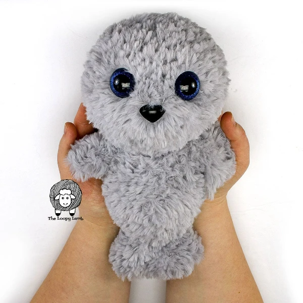 A faux fur crochet seal plushie/