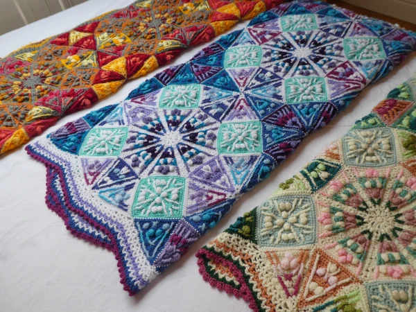 A beautifully detailed tapestry crochet blanket in three different colourways.