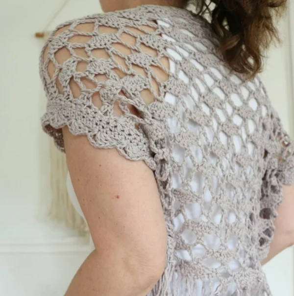 Back view of lacy crochet shrug.
