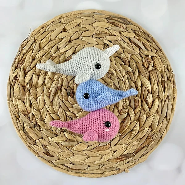 Three mini crochet whale amigurumi.