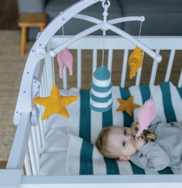 A seaside -themed crochet baby mobile.