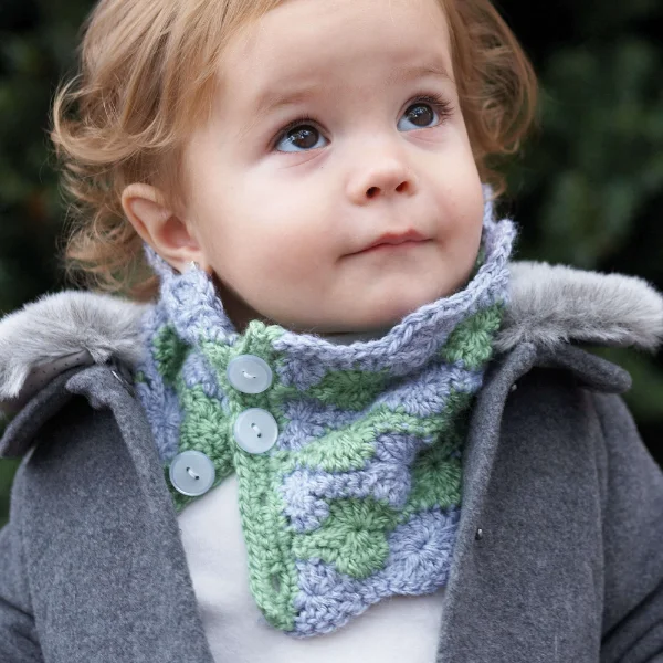 A child-sized button crochet cowl featuring the catherine wheel stitch.