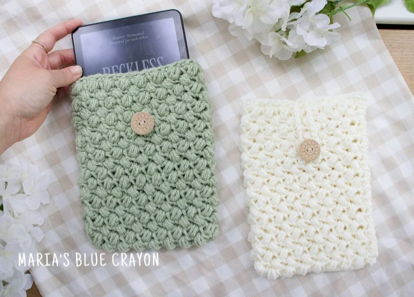 Two crochet kindle sleeves.