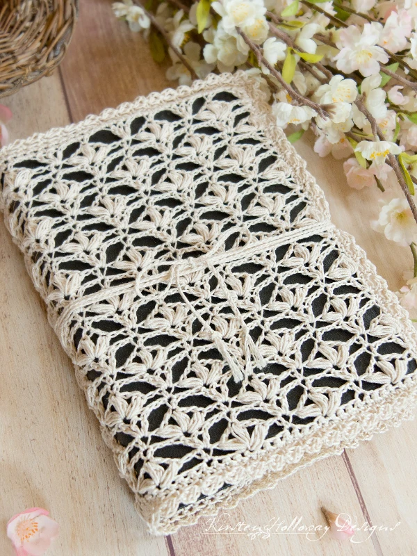 A bible with a crocheted lace cover.