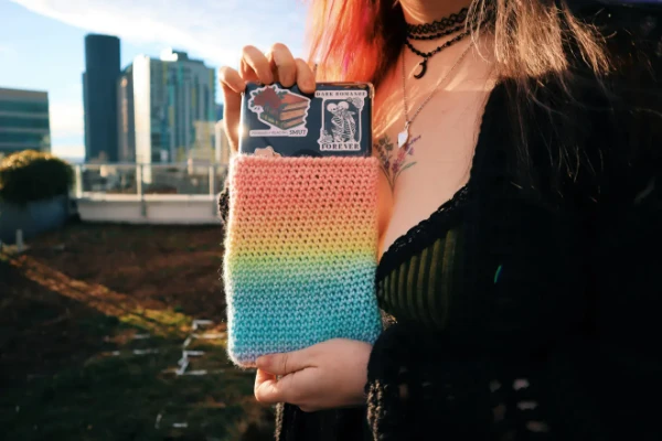 Rainbow coloured crochet Kindle pouch.