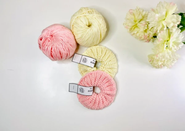Pink and yellow crochet scrunchies.