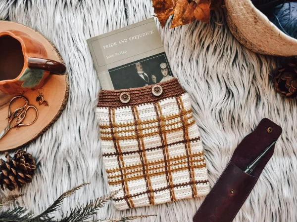 A tartan-inspired crochet book sleeve.