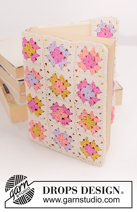 A book with a crochet book cover made with mini granny squares.
