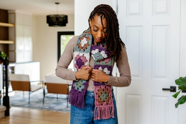 A granny square scarf made in chunky weight yarn.