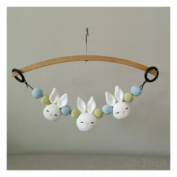 A crochet stroller chain with bunnies.