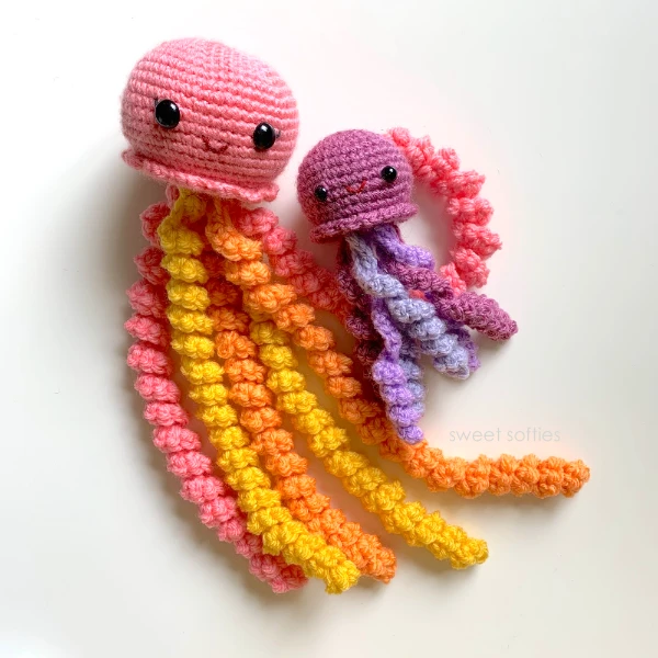 Brightly coloured crochet jellyfish toys in both small and large sizes.