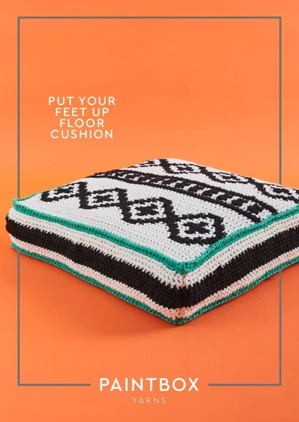 A brightly coloured geometric tapestry crochet floor pillow.