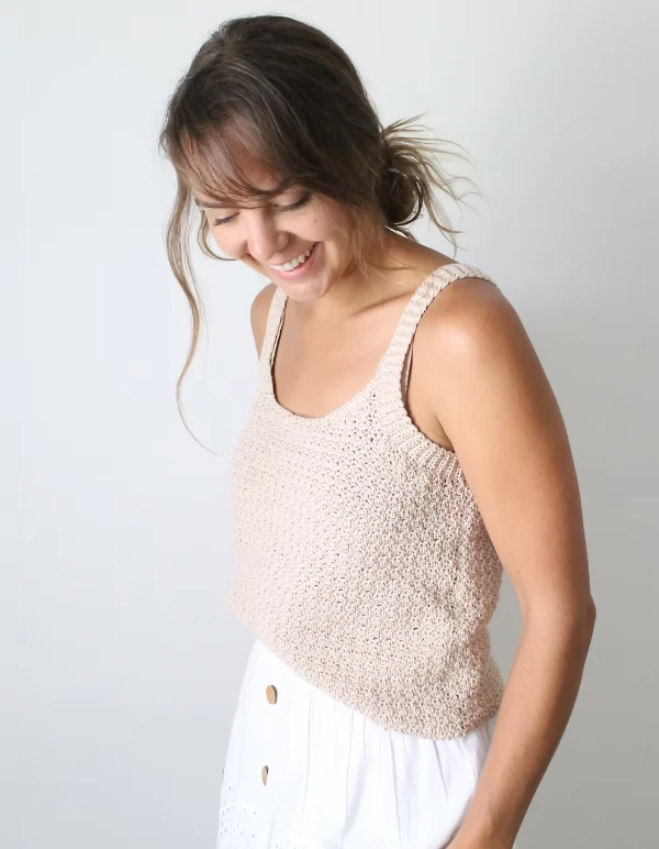 Woman wearing a crochet tank top.