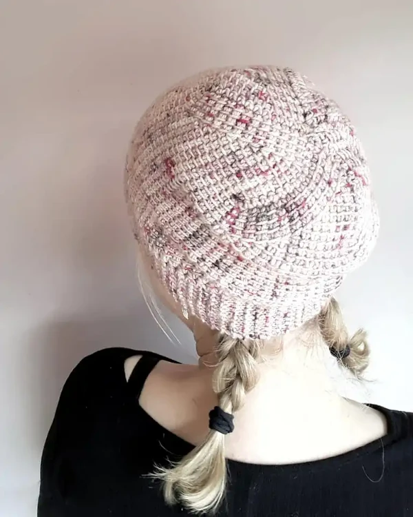 A back view of a shaped Tunisian crochet hat.