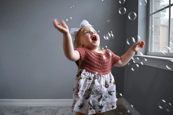 A crochet bodice childs dress.