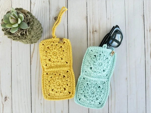 Crochet glasses cases made with flower granny motifs.
