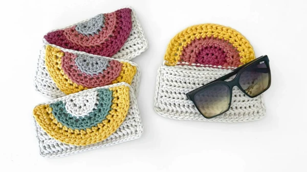 Rainbow themed crochet glasses cases.