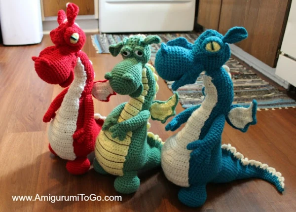 Three variations of a detailed crochet dragon amigurumi.