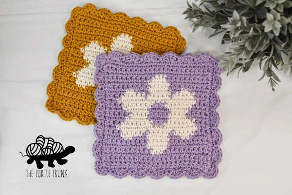 Crochet dishcloths with tapestry crochet flower motifs.