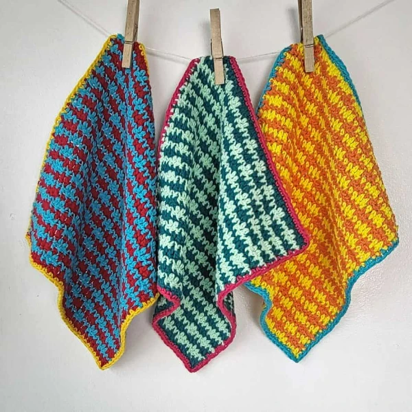 Multi-coloured houndstooth stitch crochet dishcloths.