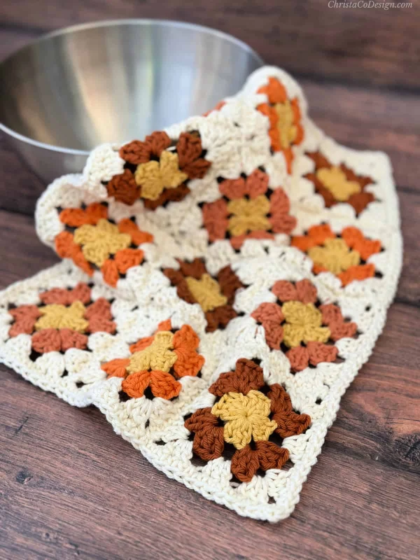 A crochet dishcloth made with mini granny squares.