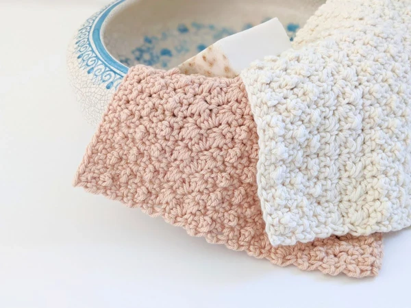 Crochet dishcloths made in pretty pastel colours.