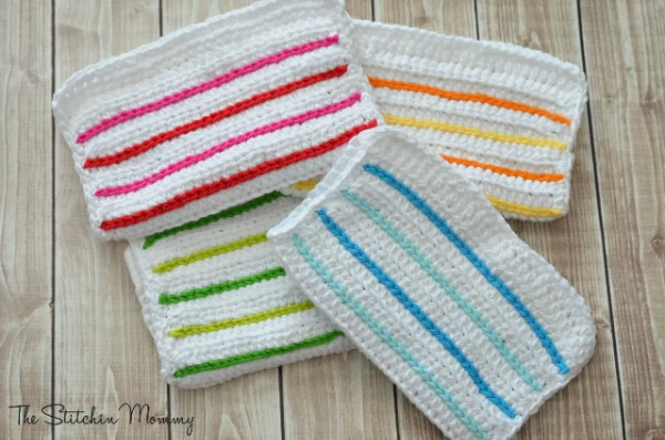 Crochet dishcloths with surface crochet stripes.