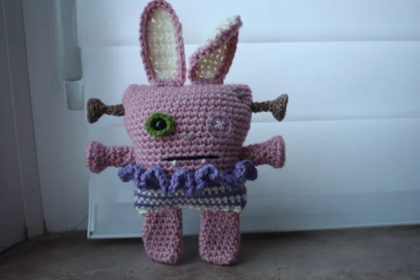 A frankenstein-style bunny monster toy.