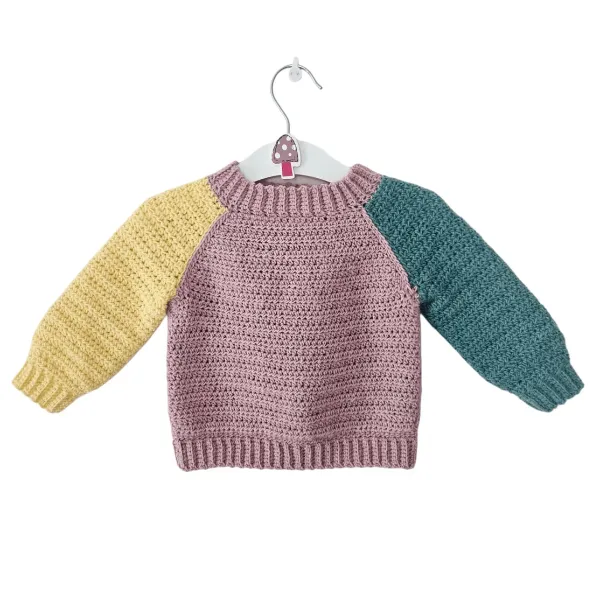 A kids' crochet sweater featuring colour blocking.