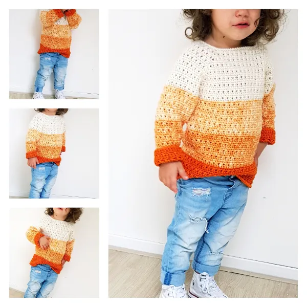 A toddler wearing a homemade, striped crochet sweater.
